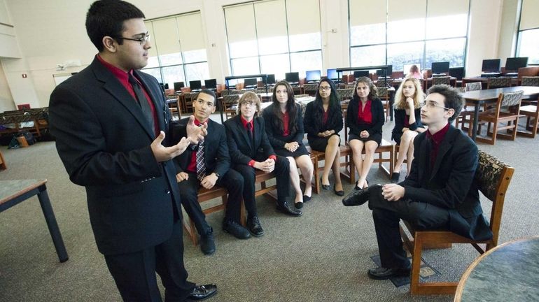 (L-R) Umar Khan cross-examines Jonathan Gilbert, the witness, as fellow...