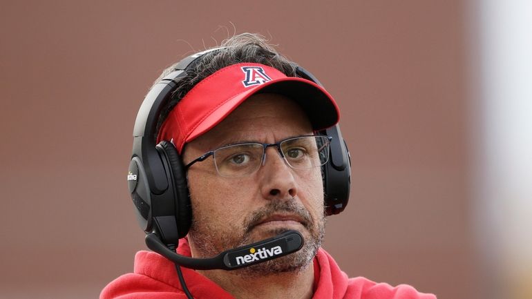 Arizona coach Jedd Fisch stands on the sideline during the...