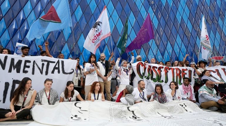 Pro-Palestinian demonstrators participate in a protest against the Israel-Hamas during...