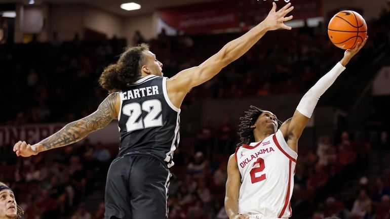 Oklahoma guard Javian McCollum (2) shoots in front of Providence...