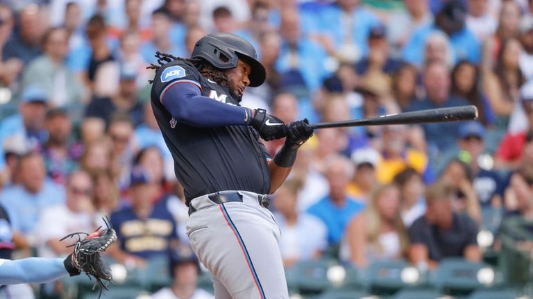 Miami Marlins' Josh Bell watches his double during the second...