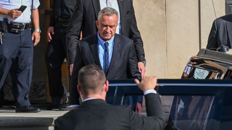 Independent presidential candidate Robert F. Kennedy Jr., top, leaves after...