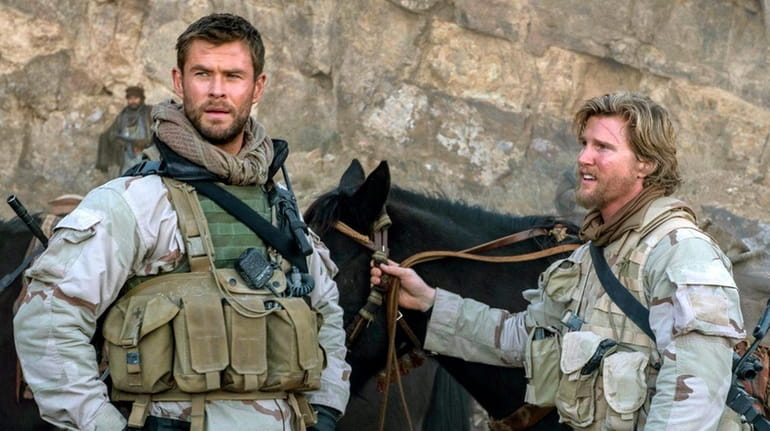 Chris Hemsworth, left, and Thad Luckinbill in "12 Strong."