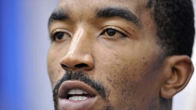 J.R. Smith talks to reporters after practice. (Oct. 5, 2012)