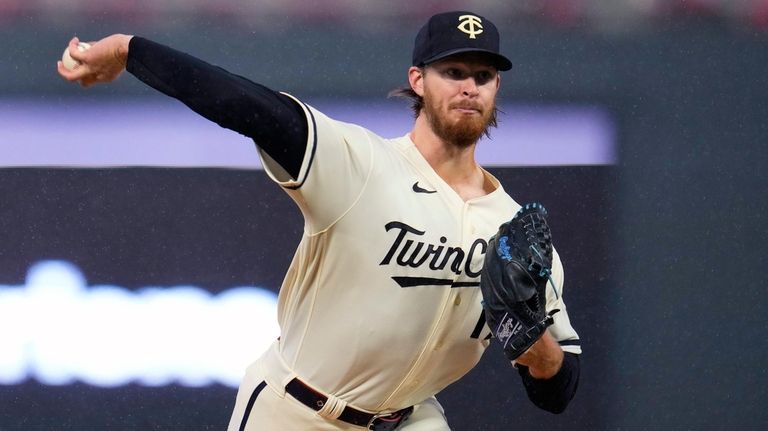 Minnesota Twins starting pitcher Bailey Ober delivers to an Oakland...