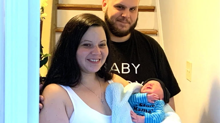 Steven Ortner, Lisa Ostrowski and their baby, Leo.