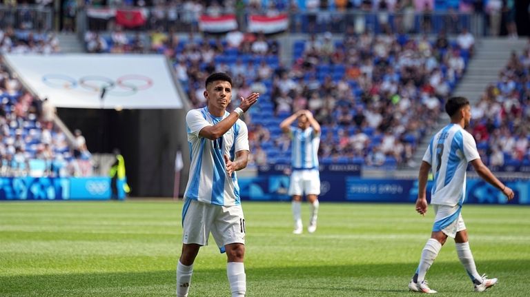 Argentina's Thiago Almada gestures during the men's Group B soccer...