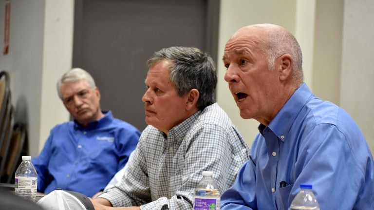 Montana Republican Gov. Greg Gianforte, right, talks about Biden administration...