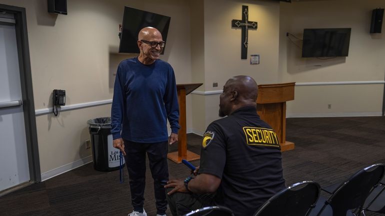 Timothy Walker, left, a resident at the Los Angeles Mission...