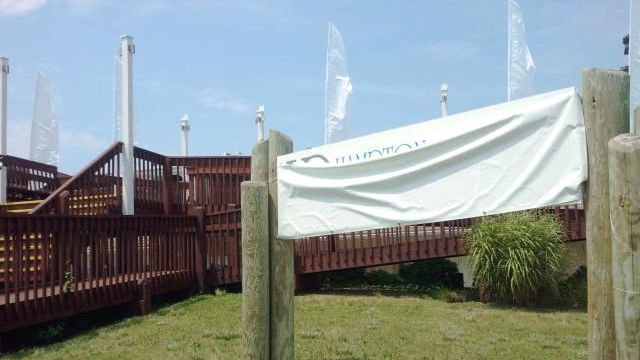 A tarp covers the logo of Hampton Quarters, the restaurant...