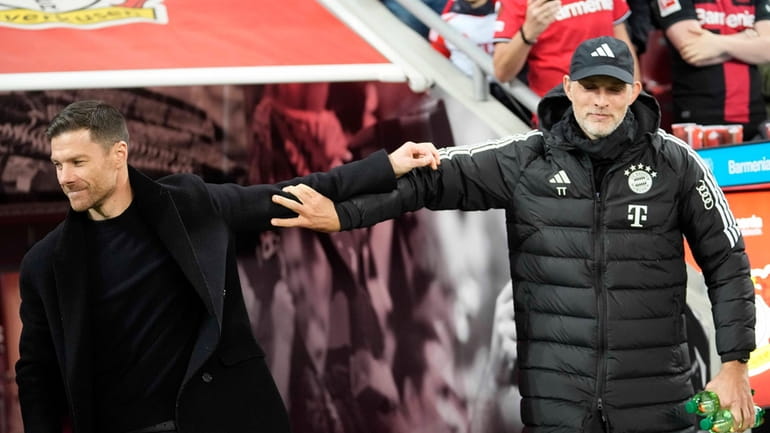 Bayern's head coach Thomas Tuchel, right, welcomes Leverkusen's head coach...