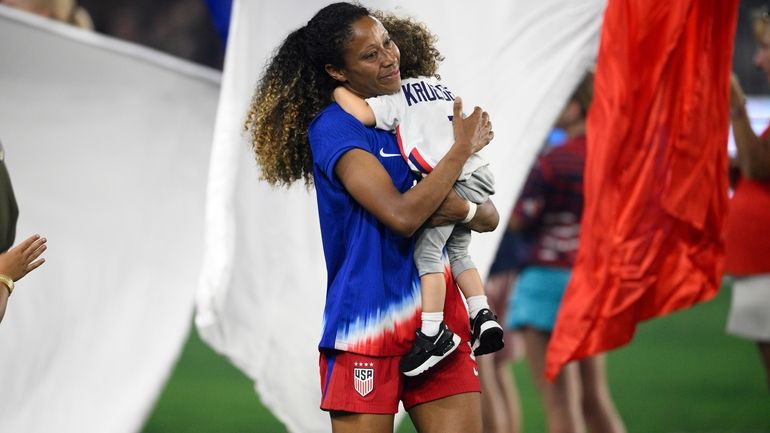 United States defender Casey Krueger walks on the field during...