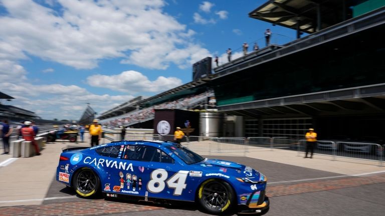 Jimmie Johnson pull into the garage area during a practice...