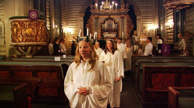 After a church service on Santa Lucia Day, choir girls...
