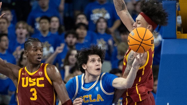 UCLA forward Berke Buyuktuncel (9) shoots next to Southern California...