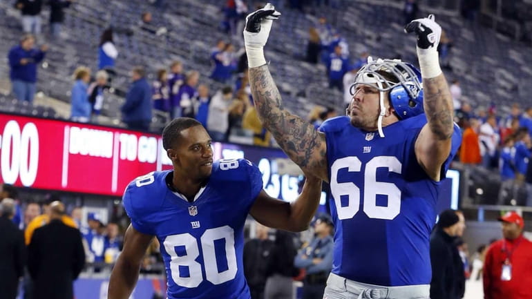 David Diehl and Victor Cruz celebrate after defeating the Minnesota...
