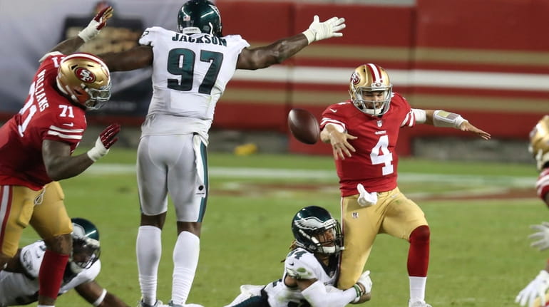 San Francisco 49ers quarterback Nick Mullens (4) fumbles the ball...
