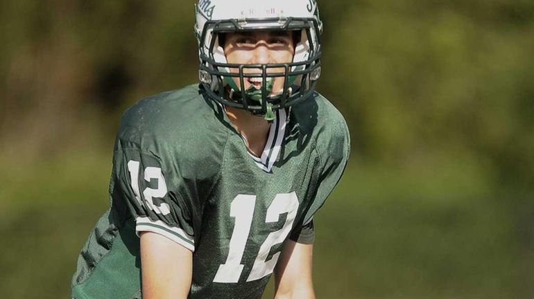 Locust Valley QB (green jersey) #12 Joe Jacobi calls a...