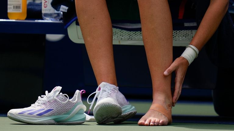 Karolina Pliskova, of the Czech Republic, checks her ankle before...