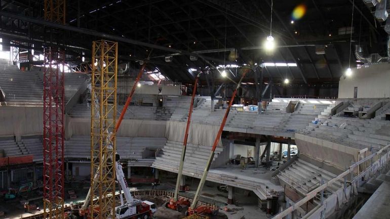 View from upper seating area looking to main arena under...