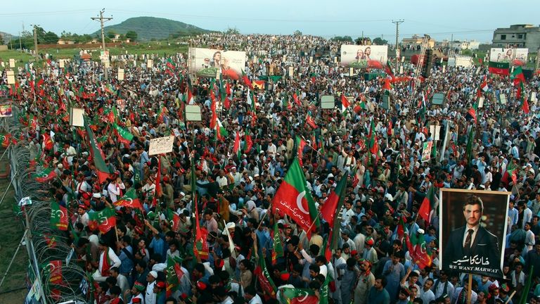 Supporters of imprisoned former Prime Minister Imran Khan take a...