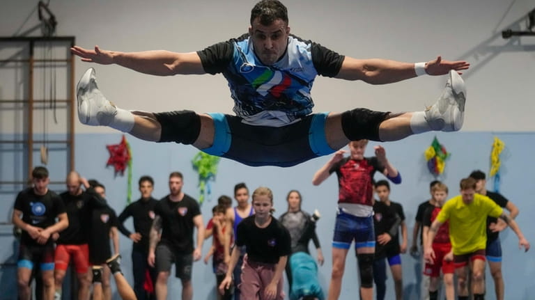 Iranian wrestler Iman Mahdavi, 28, practices at the Lotta Club...