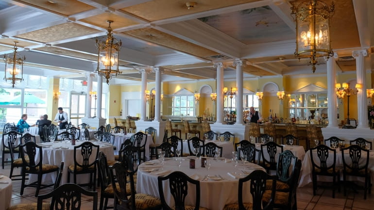 The dining room of the Carltun is accented with white...