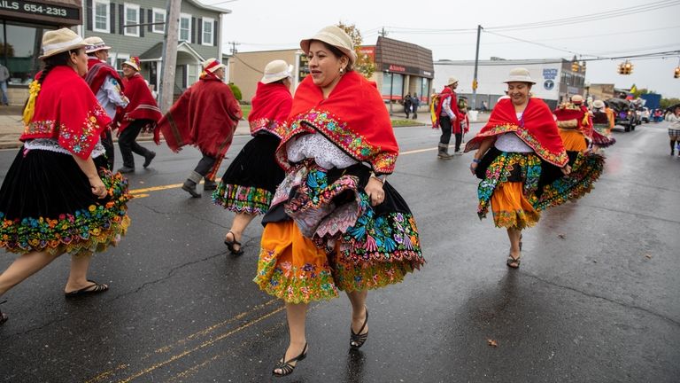 Grupo De Danza Los Runos members perform an Ecuadorian dance...