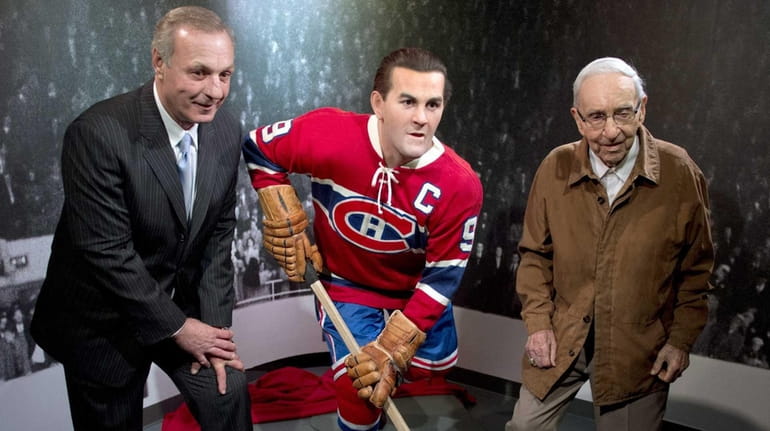 Former Montreal Canadiens Guy Lafleur, left, and Bob Fillion, right,...