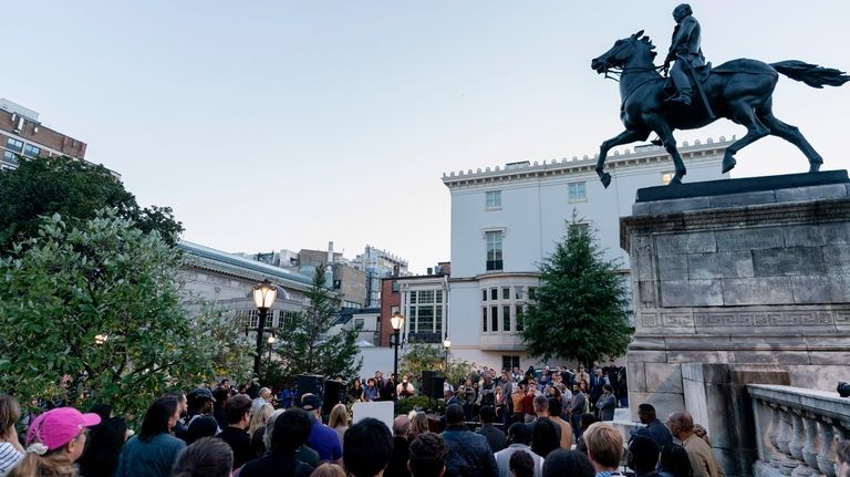 People attend a vigil in memory of Pava LaPere, founder...