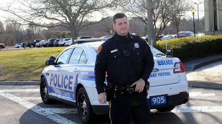 Suffolk County Police Highway Patrol Officer Joseph Goss stands in...