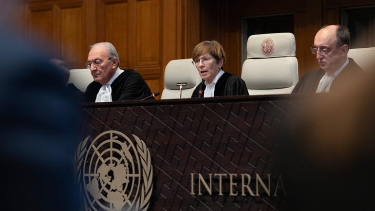 Presiding judge Joan Donoghue, center, reads the International Court of...