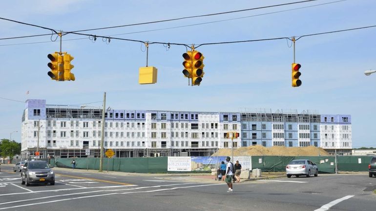 Construction continues on Monday, June 23, 2014, on a residential...