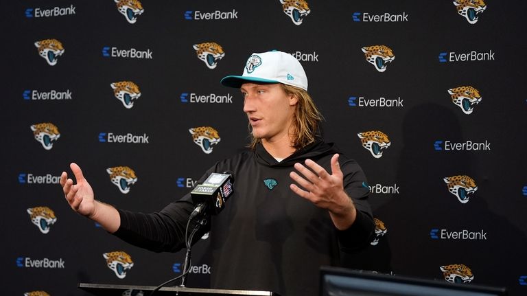 Jacksonville Jaguars quarterback Trevor Lawrence answers questions at a news...