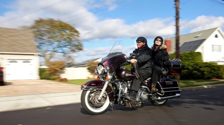 John Figueroa and his wife, Theresa Mirachi Figueroa, are motorcycle...