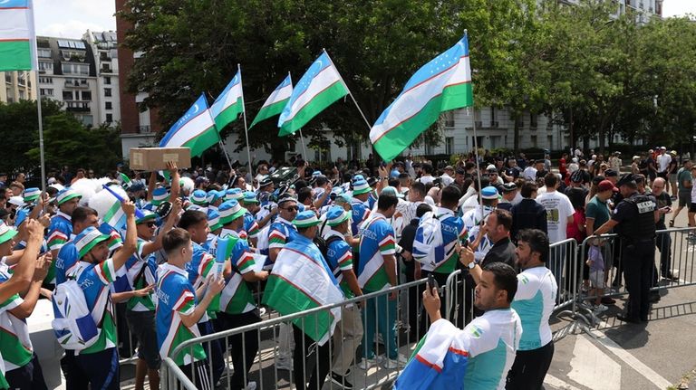 Uzbekistan supporters gather ahead of the men's group C match...