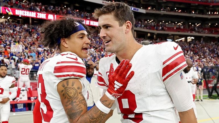 Jalin Hyatt of the New York Giants celebrates with Daniel...