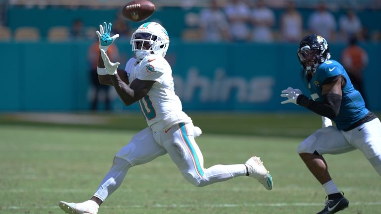 Miami Dolphins wide receiver Tyreek Hill (10) grabs a pass...