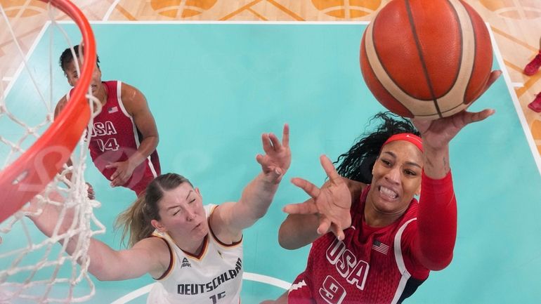 A'ja Wilson (9), of the United States, shoots over Luisa...