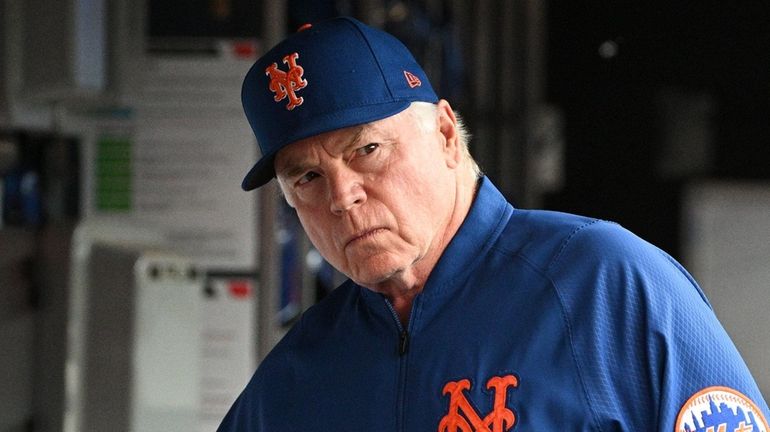 Mets manager Buck Showalter looks on from the dugout before...