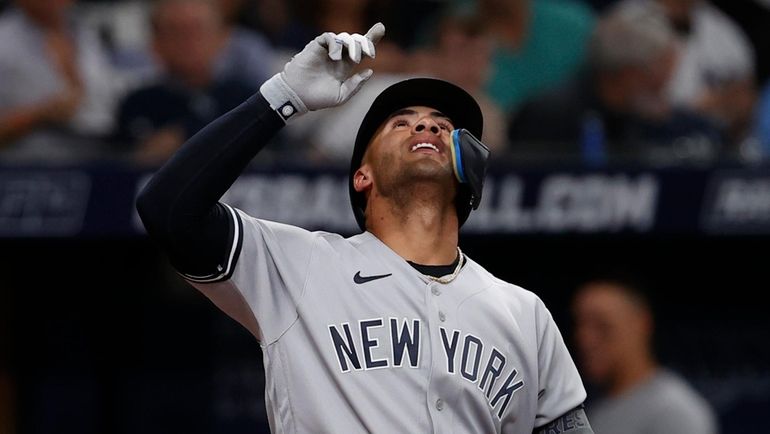 Yankees' Gleyber Torres gestures after hitting a home run against...