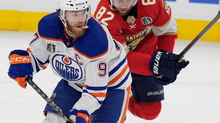 Edmonton Oilers center Connor McDavid (97) skates with the puck...