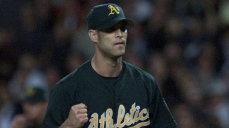 Oakland's pitcher Tim Hudson reacts in the top of the...