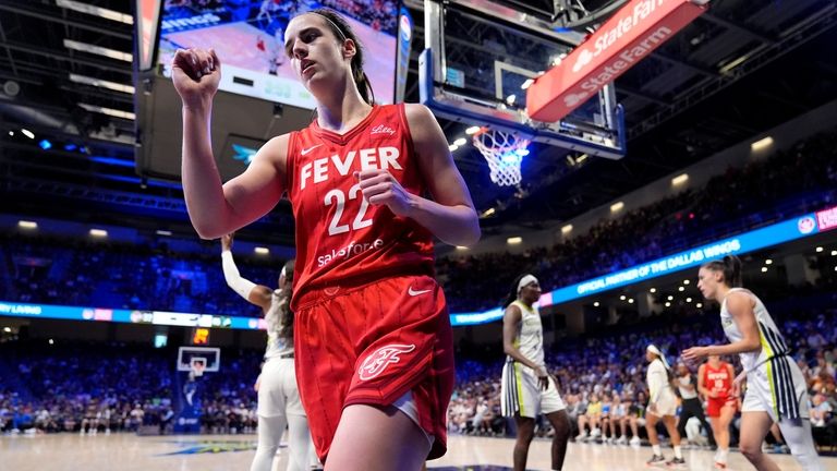 Indiana Fever's Caitlin Clark (22) celebrates after sinking a basket...