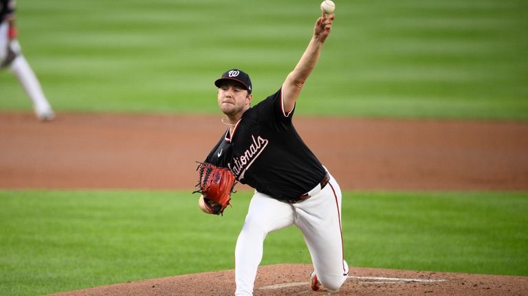 Washington Nationals starting pitcher Mitchell Parker throws during the second...