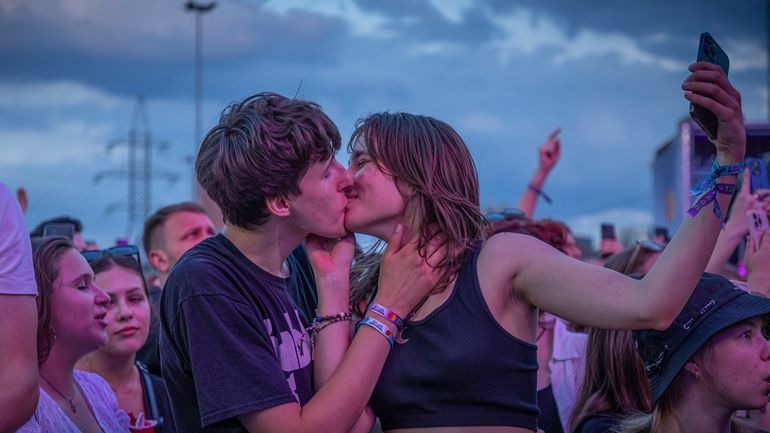 People enjoy a concert at the Atlas Festival in Kyiv,...