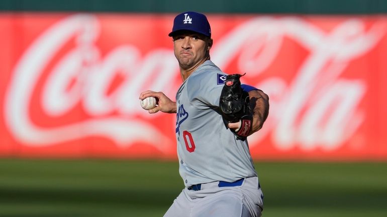 Dodgers pitcher Jack Flaherty throws to an Oakland Athletics batter...