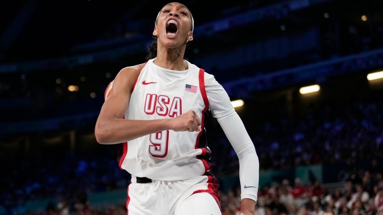 A'ja Wilson, of the Unites States, celebrates after scoring against...