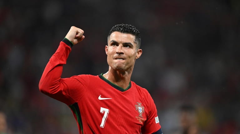 Portugal's Cristiano Ronaldo raises a fist after a Group F...