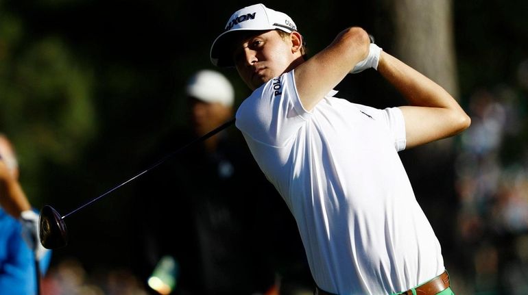 Smylie Kaufman of the US hits his tee shot on...